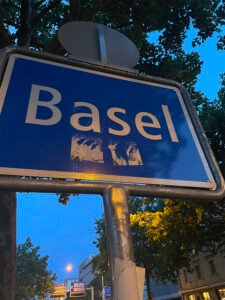The Basel sign near the border between Switzerland and France